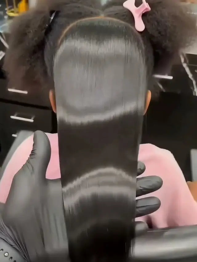 Tight curls with a sleek brushed section down the middle