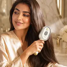 Woman brushing her silky hair with the Silkaya mist brush
